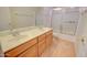 Bathroom with double vanity and shower/tub combo at 19999 W Fawny Ln, Casa Grande, AZ 85122