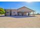 Rear view of house with large covered patio at 19999 W Fawny Ln, Casa Grande, AZ 85122