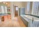 Large bathroom with soaking tub, shower, and double vanity at 19999 W Fawny Ln, Casa Grande, AZ 85122