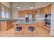 Spacious kitchen with an island, ample cabinetry, and stainless steel appliances at 19999 W Fawny Ln, Casa Grande, AZ 85122
