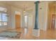 Elegant entryway with hardwood floors, stained glass, and a view to the living room at 19999 W Fawny Ln, Casa Grande, AZ 85122