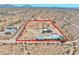 Aerial view showing a house and large lot with outbuildings in a desert landscape at 19999 W Fawny Ln, Casa Grande, AZ 85122