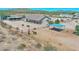 Aerial view of a single-story house with horse stables and a large yard at 19999 W Fawny Ln, Casa Grande, AZ 85122