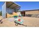 Metal barn with hay bales, wheelbarrows, and gardening tools at 19999 W Fawny Ln, Casa Grande, AZ 85122