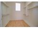 Walk-in closet with ample shelving and hanging space at 19999 W Fawny Ln, Casa Grande, AZ 85122