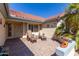 Covered patio with brick flooring and seating area at 15316 W Sky Hawk Dr, Sun City West, AZ 85375