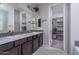 Double vanity bathroom with a walk-in closet and shower at 15161 W Pierce St, Goodyear, AZ 85338