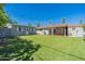 Artificial turf backyard with covered patio and shed at 4649 N 74Th Pl, Scottsdale, AZ 85251