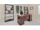 Home office with large desk, built-in shelving, and natural light at 10015 N 55Th St, Paradise Valley, AZ 85253