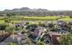 Aerial view of house, pool, and golf course at 10015 N 55Th St, Paradise Valley, AZ 85253