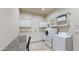 Laundry room with washer, dryer, and granite countertop at 2744 S First Water Ln, Gold Canyon, AZ 85118