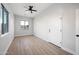 Spacious bedroom with ceiling fan and large window at 21743 S 140Th St, Chandler, AZ 85286