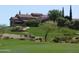 Community clubhouse nestled on a hillside with a golf course at 2744 S First Water Ln, Gold Canyon, AZ 85118