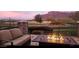 Relaxing patio with fire pit and mountain views at 2744 S First Water Ln, Gold Canyon, AZ 85118