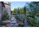 Stone pathway with desert plants and cacti at 18651 N 101St Pl, Scottsdale, AZ 85255