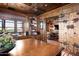 Home office with rustic barn door and views into a secondary sitting area at 18651 N 101St Pl, Scottsdale, AZ 85255