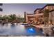 Expansive pool and spa with a waterfall and seating at 18651 N 101St Pl, Scottsdale, AZ 85255