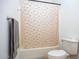 Bathroom with tub and rainbow shower curtain at 8183 W Raven Dr, Arizona City, AZ 85123