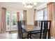 Dining area with table and chairs, access to backyard patio at 8183 W Raven Dr, Arizona City, AZ 85123