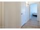 Hallway with tile flooring and access to bedrooms at 8183 W Raven Dr, Arizona City, AZ 85123