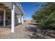 Backyard with gravel landscaping and covered patio at 8183 W Raven Dr, Arizona City, AZ 85123