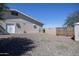 Side yard with gravel and a storage shed at 8183 W Raven Dr, Arizona City, AZ 85123