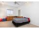 Bedroom with twin bed and built-in desk at 8183 W Raven Dr, Arizona City, AZ 85123