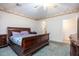 Primary bedroom with a king-size bed and en-suite bathroom access at 8183 W Raven Dr, Arizona City, AZ 85123