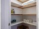Well-organized pantry with ample shelving for storage at 8183 W Raven Dr, Arizona City, AZ 85123