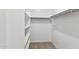 Walk-in closet with shelving and hanging rods at 15399 W Desert Hollow Dr, Surprise, AZ 85387