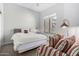 Serene bedroom with a comfortable bed and striped armchair at 2133 N Atwood --, Mesa, AZ 85207