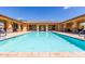 Resort-style pool with a covered patio and lounge chairs at 2133 N Atwood --, Mesa, AZ 85207