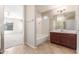 Bathroom featuring a tub, vanity, and tiled floor at 43809 W Elm Dr, Maricopa, AZ 85138