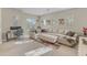 Spacious living room with comfortable sectional sofa and workspace at 15201 S 183Rd Dr, Goodyear, AZ 85338