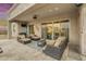 Covered patio with comfortable seating and outdoor kitchen at 15201 S 183Rd Dr, Goodyear, AZ 85338