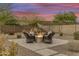 Peaceful backyard with a fire pit and seating area, perfect for gatherings at 15201 S 183Rd Dr, Goodyear, AZ 85338