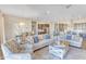 Open living area with cozy seating and a view into the kitchen at 15201 S 183Rd Dr, Goodyear, AZ 85338