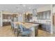Spacious kitchen with granite countertops, stainless steel appliances, and dark wood cabinetry at 15201 S 183Rd Dr, Goodyear, AZ 85338