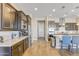 Modern kitchen with granite countertops and stainless steel appliances at 15201 S 183Rd Dr, Goodyear, AZ 85338