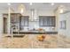 Modern kitchen island with granite countertops and stainless steel appliances at 15201 S 183Rd Dr, Goodyear, AZ 85338