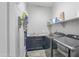Functional laundry room with washer, dryer, and storage at 15201 S 183Rd Dr, Goodyear, AZ 85338
