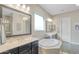 Elegant bathroom with double vanity, soaking tub, and separate shower at 15201 S 183Rd Dr, Goodyear, AZ 85338