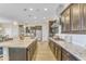 Large kitchen with granite countertops and stainless steel appliances at 15201 S 183Rd Dr, Goodyear, AZ 85338