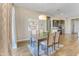 Casual dining area with a table for six and access to the backyard at 15201 S 183Rd Dr, Goodyear, AZ 85338