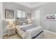 Bright bedroom with wood bed frame and nautical-themed decor at 15201 S 183Rd Dr, Goodyear, AZ 85338