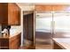 Kitchen with stainless steel appliances and access to a pantry at 10648 E Greythorn Dr, Scottsdale, AZ 85262