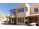 Two-story home with stucco exterior and large windows at 10648 E Greythorn Dr, Scottsdale, AZ 85262