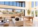 Bright great room with large windows, sectional sofa, and pool table at 10648 E Greythorn Dr, Scottsdale, AZ 85262