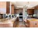 Gourmet kitchen featuring granite countertops and double ovens at 10648 E Greythorn Dr, Scottsdale, AZ 85262