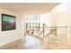 Long hallway with tile floors and a view of a game room at 10648 E Greythorn Dr, Scottsdale, AZ 85262